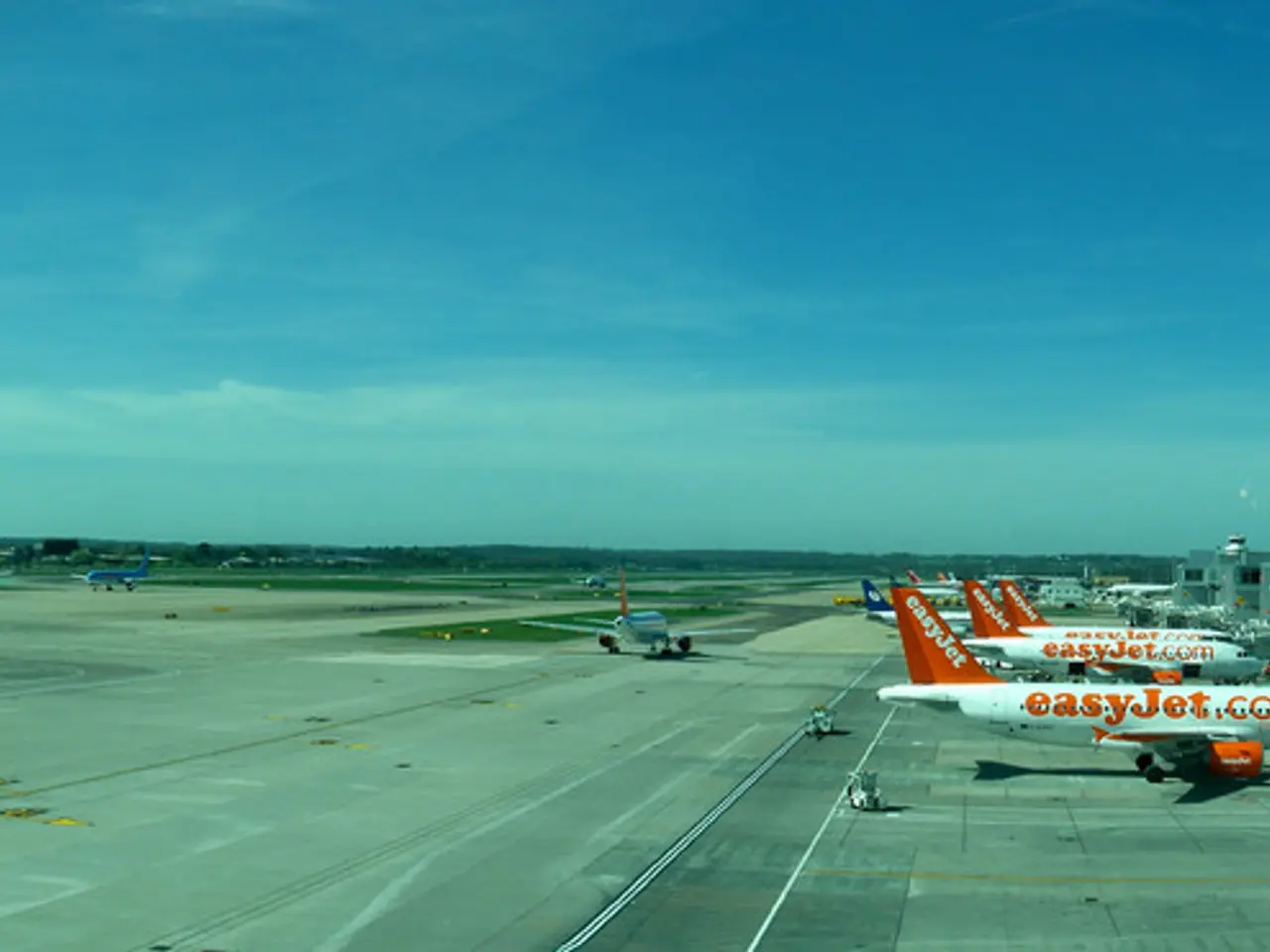 This is the picture of an airport. In this image there are aircrafts and there are buildings and...