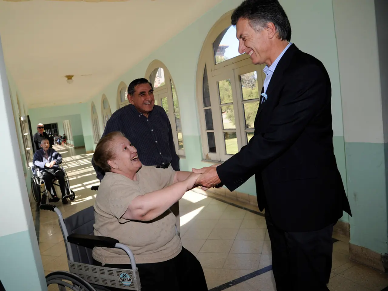 In the image we can see there are people wearing clothes. They are standing and two of them are...