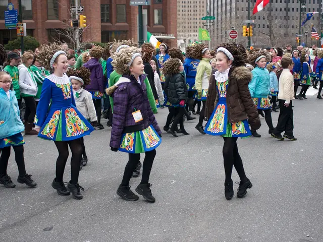 In this picture there is a group of girls wearing dress with jackets and sweaters dancing on the...