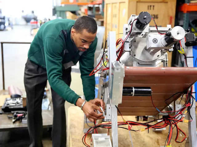 In this picture I can see a man standing and looks like he is fixing a machine and I can see few...