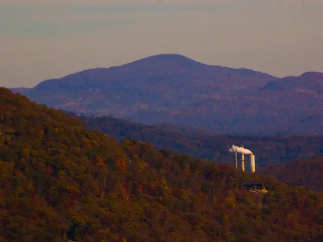 In this picture I can see factory. From the exhaust I can see the smoke. In the background I can...