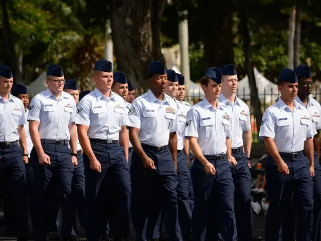 This picture is clicked outside the city. In the middle of the picture, we see men in the uniform...